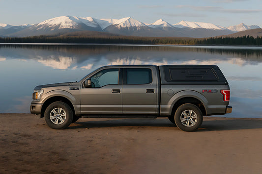 A tough-looking pickup truck with a perfectly fitted truck cap, ready for a Canadian adventure.